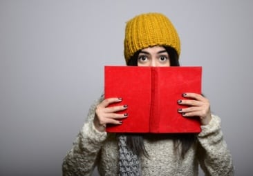 student holding a book