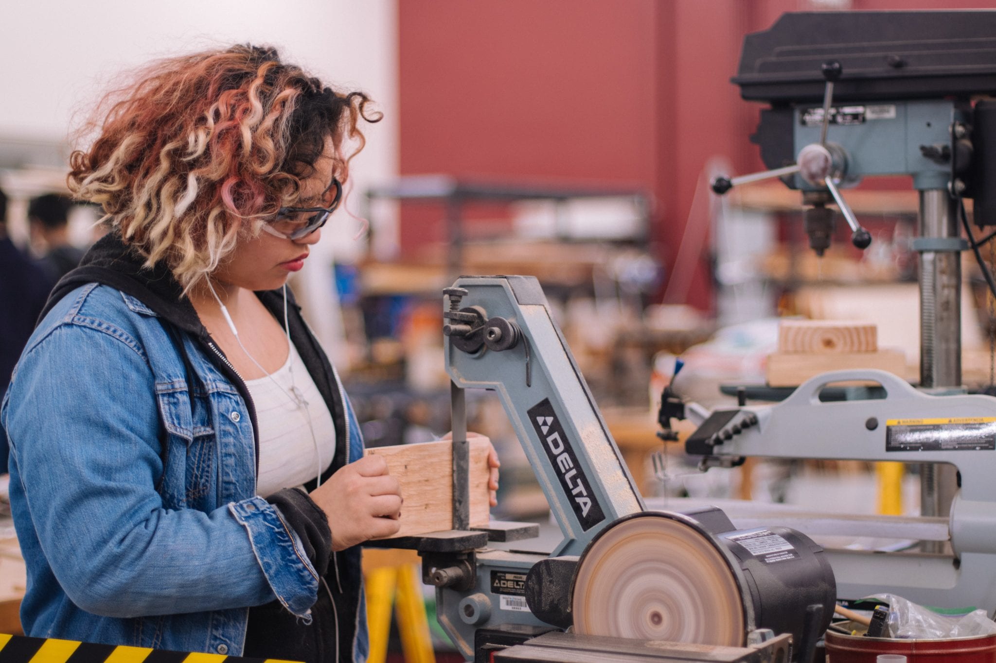 Guided pathway guides woman student with woodcrafts