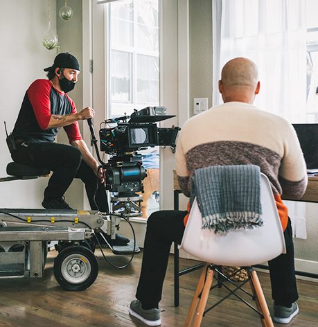 video production services guy films on dolly